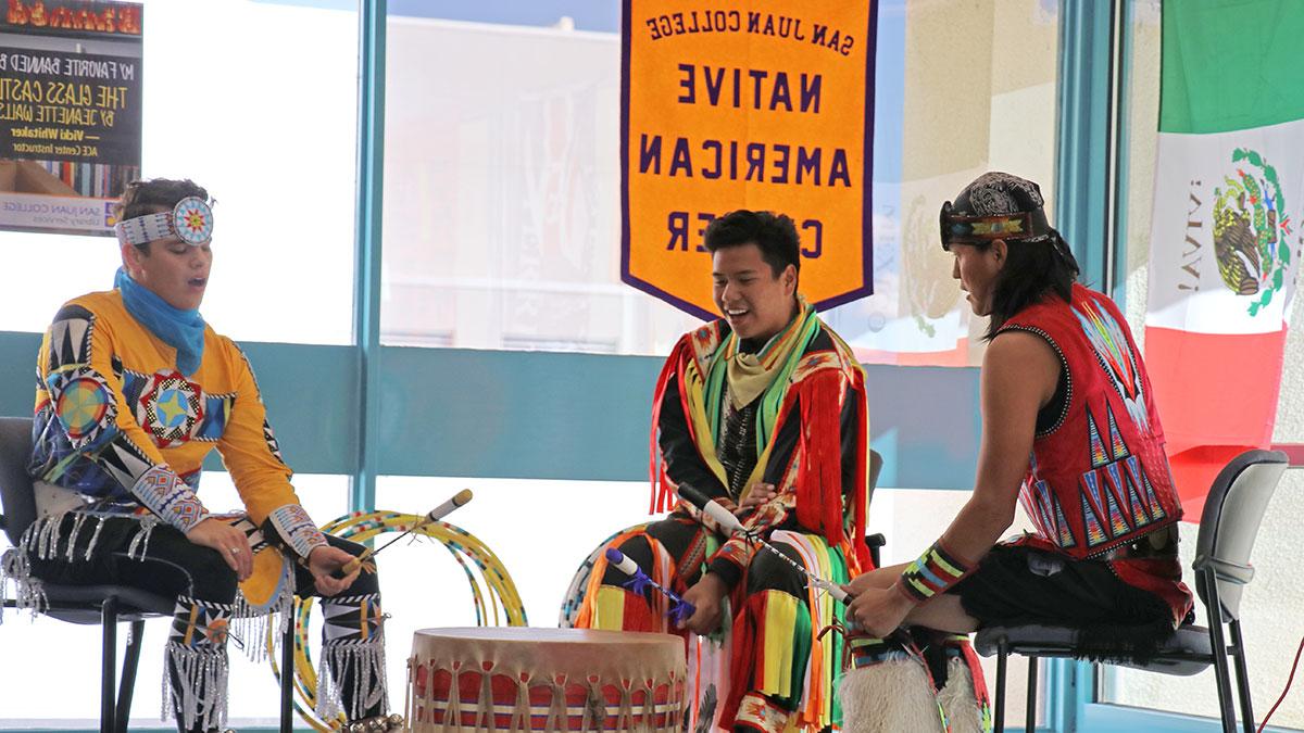 Native American students participating in drum circle